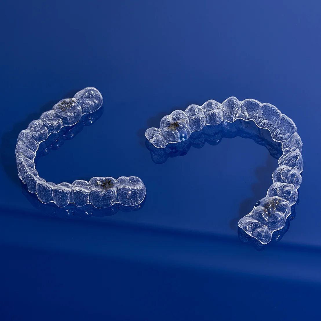 Invisalign clear aligners blue background