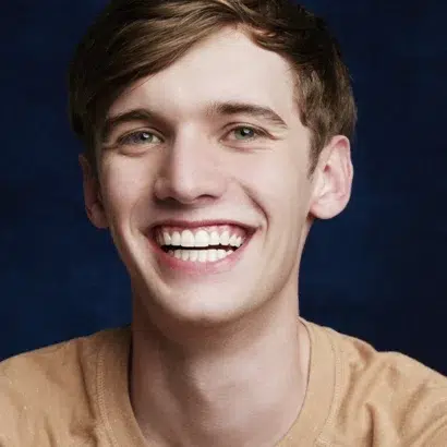 Teen boy smiling confidently after invisalign treatment