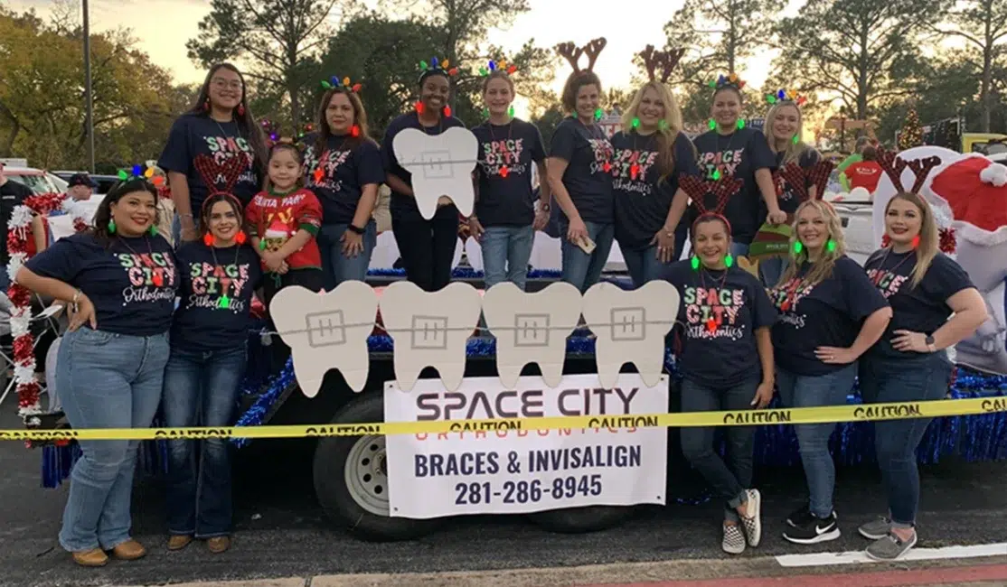 Space City Orthodontics team members on float