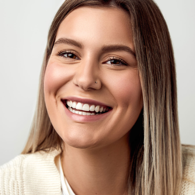 woman smiling after removing braces at houston orthodontist